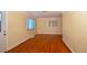 Bright living room with gleaming hardwood floors and large windows at 2211 Quebec St, Denver, CO 80207
