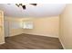 Bright living room with hardwood floors, natural light, and neutral yellow walls at 2211 Quebec St, Denver, CO 80207