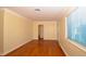 Bright living room features hardwood floors and arched doorway at 2211 Quebec St, Denver, CO 80207