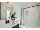 Modern bathroom with white tile and a large mirror at 3153 Benton St, Wheat Ridge, CO 80214