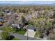 Expansive view of the home's location with mature trees and private detached garage at 5801 W 33Rd Ave, Wheat Ridge, CO 80212