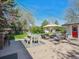 Spacious backyard with patio, outdoor kitchen, dining area, firepit, seating and string lights at 5801 W 33Rd Ave, Wheat Ridge, CO 80212