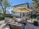 Relaxing backyard patio with comfortable seating, fire pit, dining area and attractive landscaping at 5801 W 33Rd Ave, Wheat Ridge, CO 80212
