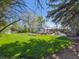 Well-manicured lawn and landscape with charming shed and outdoor entertaining area at 5801 W 33Rd Ave, Wheat Ridge, CO 80212