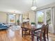 Open-concept dining and living area with hardwood floors and ample natural light at 5801 W 33Rd Ave, Wheat Ridge, CO 80212