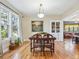 Bright dining room with hardwood floors, large windows, and stylish decor at 5801 W 33Rd Ave, Wheat Ridge, CO 80212