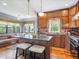 Kitchen features a kitchen island and bonus seating area by the window at 5801 W 33Rd Ave, Wheat Ridge, CO 80212