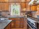 Well-appointed kitchen with wood cabinets, stainless steel appliances, and modern fixtures at 5801 W 33Rd Ave, Wheat Ridge, CO 80212