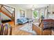 Cozy living room with a comfortable blue sofa, hardwood floors, and natural light at 5801 W 33Rd Ave, Wheat Ridge, CO 80212