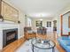 Inviting living room featuring a fireplace, hardwood floors, and ample natural light at 5801 W 33Rd Ave, Wheat Ridge, CO 80212