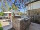 Outdoor brick kitchen featuring a built-in grill and counter space, perfect for entertaining at 5801 W 33Rd Ave, Wheat Ridge, CO 80212