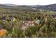 Overhead view of a secluded home surrounded by tall trees at 27987 Pine Grove Trl, Conifer, CO 80433