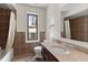Bathroom featuring a vanity with granite countertop, tile flooring and tub with shower at 27987 Pine Grove Trl, Conifer, CO 80433