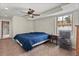Cozy bedroom featuring plush carpet, ceiling fan, and ensuite bathroom at 27987 Pine Grove Trl, Conifer, CO 80433