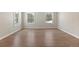 Large bedroom features laminate floors and large windows at 27987 Pine Grove Trl, Conifer, CO 80433