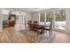 View of dining room with wood table and chairs, plus kitchen with wood cabinets and stainless steel appliances at 27987 Pine Grove Trl, Conifer, CO 80433