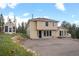Charming two-story home with a well-maintained yard and ample parking space at 27987 Pine Grove Trl, Conifer, CO 80433