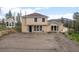 Charming two-story home with a well-maintained yard and ample parking space at 27987 Pine Grove Trl, Conifer, CO 80433