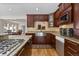 Well-appointed kitchen with stainless appliances, custom cabinetry, and granite countertops at 27987 Pine Grove Trl, Conifer, CO 80433
