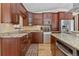 Lovely kitchen featuring stainless appliances, custom cabinetry and a view to the eating area at 27987 Pine Grove Trl, Conifer, CO 80433