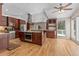 Spacious kitchen features stainless steel appliances, granite countertops, and a central island with a built-in oven at 27987 Pine Grove Trl, Conifer, CO 80433