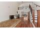 Open floor plan featuring beautiful hardwood flooring, staircase to 2nd level, and dining area at 27987 Pine Grove Trl, Conifer, CO 80433