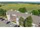 Apartment building with balconies, well-maintained landscaping, and convenient parking near open green spaces at 8654 Decatur St # 251, Westminster, CO 80031