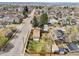 Aerial shot showcases a charming property nestled among mature trees in a quiet neighborhood at 4290 S Cherokee St, Englewood, CO 80110