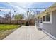Exterior featuring wood deck, lush grass, and a partial fence at 4290 S Cherokee St, Englewood, CO 80110