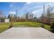 Backyard featuring a wooden deck, green lawn, and partial fencing at 4290 S Cherokee St, Englewood, CO 80110
