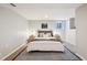 Bedroom featuring a well-made bed, side tables, and soft lighting at 4290 S Cherokee St, Englewood, CO 80110