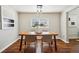 Elegant dining room features a wooden table, woven chairs, and pendant lighting at 4290 S Cherokee St, Englewood, CO 80110