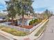 Charming home with a white picket fence, landscaped garden, and mature trees at 4290 S Cherokee St, Englewood, CO 80110