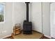 Cozy fireplace with brick accent wall and wood storage creates a warm and inviting atmosphere at 4290 S Cherokee St, Englewood, CO 80110