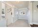Bright hallway with white walls, tiled floor and stylish accents at 4290 S Cherokee St, Englewood, CO 80110