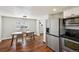 Bright kitchen with stainless steel appliances and a view of dining area at 4290 S Cherokee St, Englewood, CO 80110