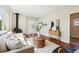 Bright living room with wood-burning stove, hardwood floors, and stylish decor at 4290 S Cherokee St, Englewood, CO 80110