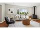 Inviting living room with natural light, modern furnishings, and stylish fireplace at 4290 S Cherokee St, Englewood, CO 80110