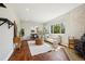Cozy living room with wood floors, a fireplace, and comfortable seating at 4290 S Cherokee St, Englewood, CO 80110