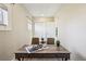 Bright office featuring a wooden desk, two chairs, and modern decor at 4290 S Cherokee St, Englewood, CO 80110