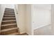 Carpeted staircase leading to the upper level of the home at 4290 S Cherokee St, Englewood, CO 80110
