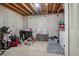 Large, unfinished basement space ready for customization and storage at 1818 S Quebec Way # 11-3, Denver, CO 80231