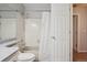 Well-lit bathroom featuring a bathtub with shower and tiled walls at 1818 S Quebec Way # 11-3, Denver, CO 80231