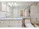Bright bathroom features a vanity with ample storage space and a large mirror at 1818 S Quebec Way # 11-3, Denver, CO 80231