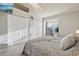 Comfortable bedroom with a work space by the window and ample closet space at 1818 S Quebec Way # 11-3, Denver, CO 80231