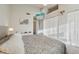 Well lit primary bedroom with comfortable bed and dual closets at 1818 S Quebec Way # 11-3, Denver, CO 80231