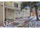 Charming townhouse exteriors with walkways in a well-maintained community at 1818 S Quebec Way # 11-3, Denver, CO 80231