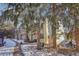 Inviting curb appeal with a well-maintained exterior and a serene, tree-lined street at 1818 S Quebec Way # 11-3, Denver, CO 80231