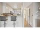Open kitchen with breakfast bar and modern appliances at 1818 S Quebec Way # 11-3, Denver, CO 80231