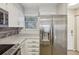Modern kitchen featuring stainless steel fridge, white cabinets, and ample counter space at 1818 S Quebec Way # 11-3, Denver, CO 80231